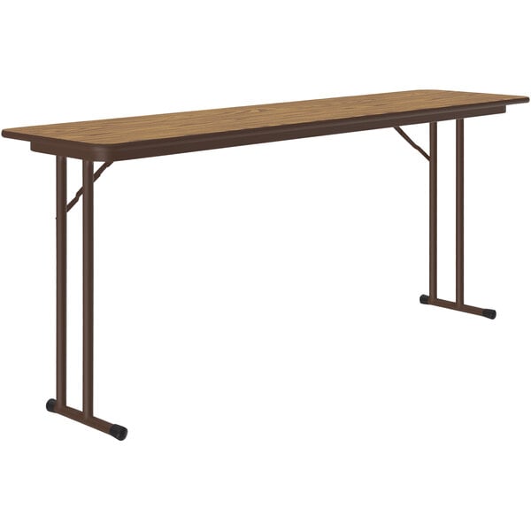 A brown rectangular Correll seminar table with black legs.