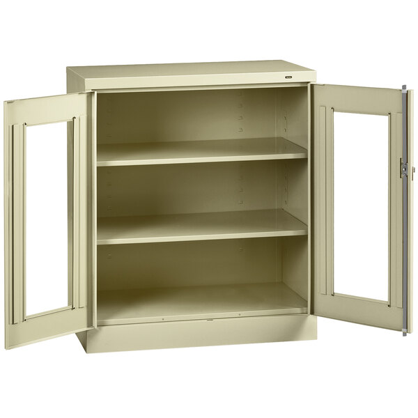 A putty storage cabinet with open C-thru doors.