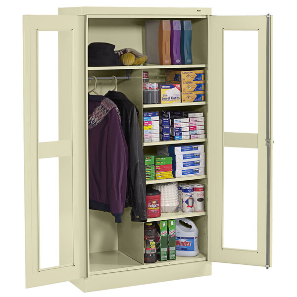 A Tennsco standard combination cabinet with C-Thru doors storing items.