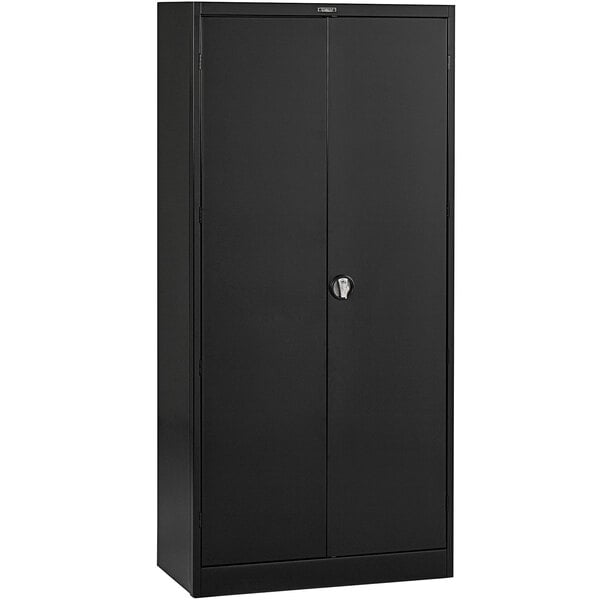 A black metal Tennsco storage cabinet with solid doors.