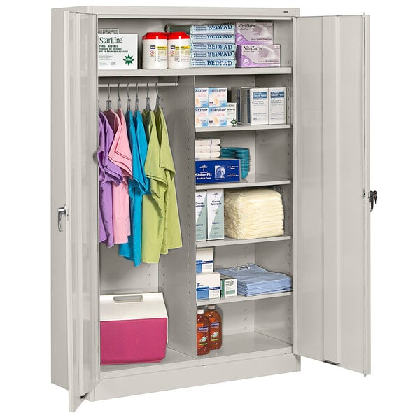 A light gray Tennsco jumbo combination cabinet with solid doors and items on the shelves.