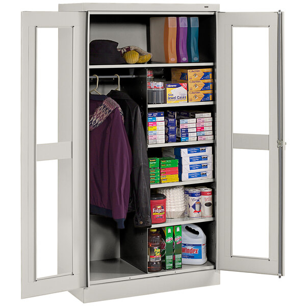 A light gray Tennsco combination cabinet with open C-Thru doors holding various items.