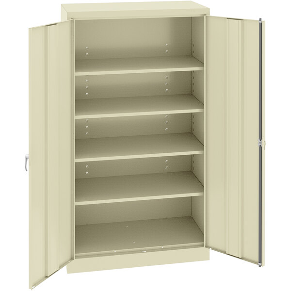 A beige metal Tennsco storage cabinet with solid doors.