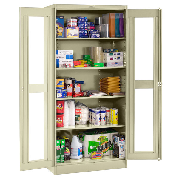 A Tennsco putty storage cabinet with C-Thru doors filled with various items.