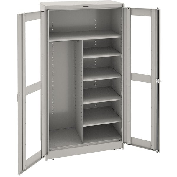A light gray metal Tennsco combination cabinet with open doors.