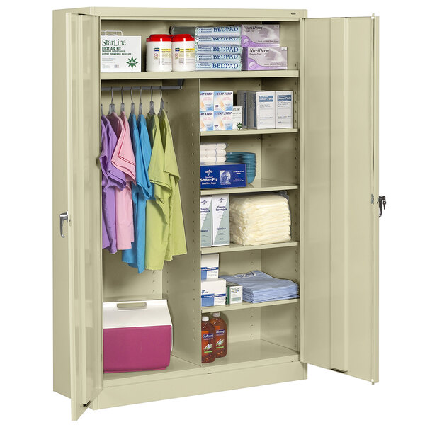 A Tennsco putty jumbo combination cabinet with solid doors filled with items.