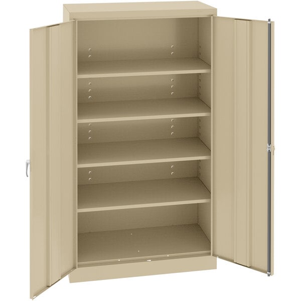 A tan Tennsco metal storage cabinet with open doors.