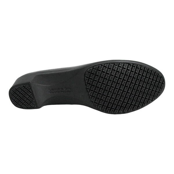 The image shows the black, textured sole of a dress shoe with a low heel.