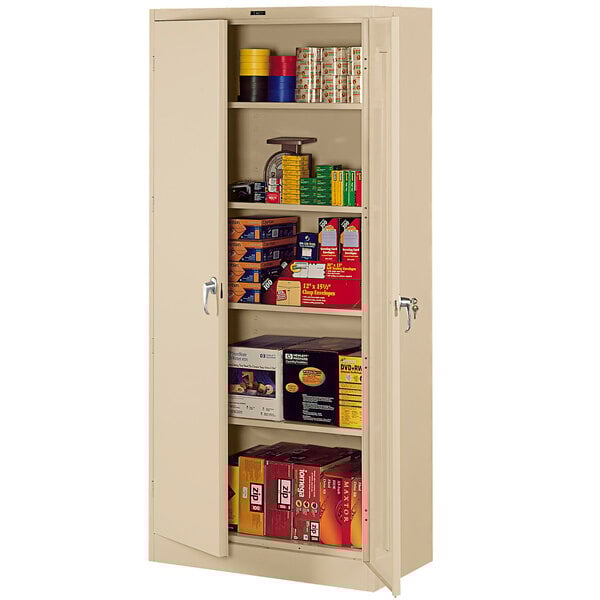 A Tennsco sand metal storage cabinet with shelves full of items.