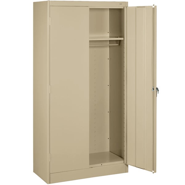 A sand Tennsco metal wardrobe cabinet with solid doors open.