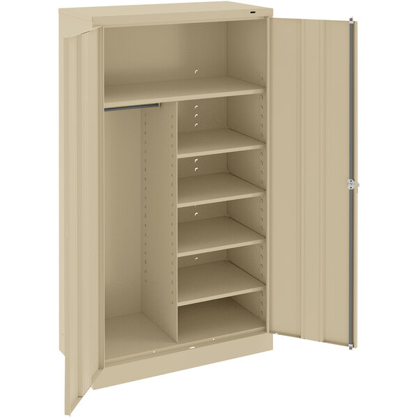 A tan metal Tennsco combination cabinet with open doors.