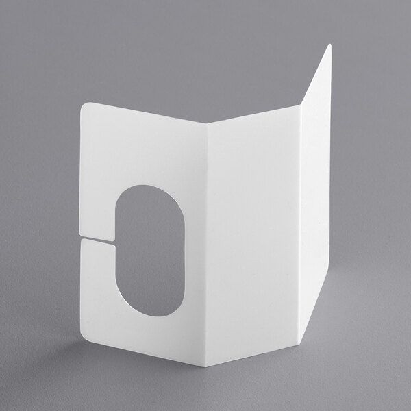 A white rectangular object with a hole in it.