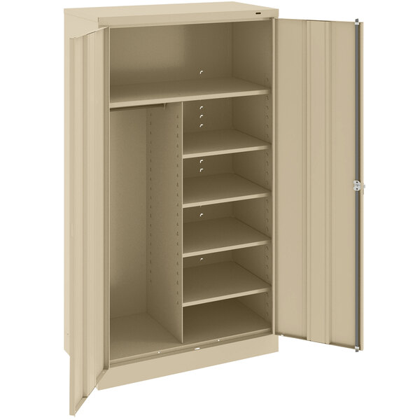 A tan metal Tennsco combination cabinet with solid doors and shelves.