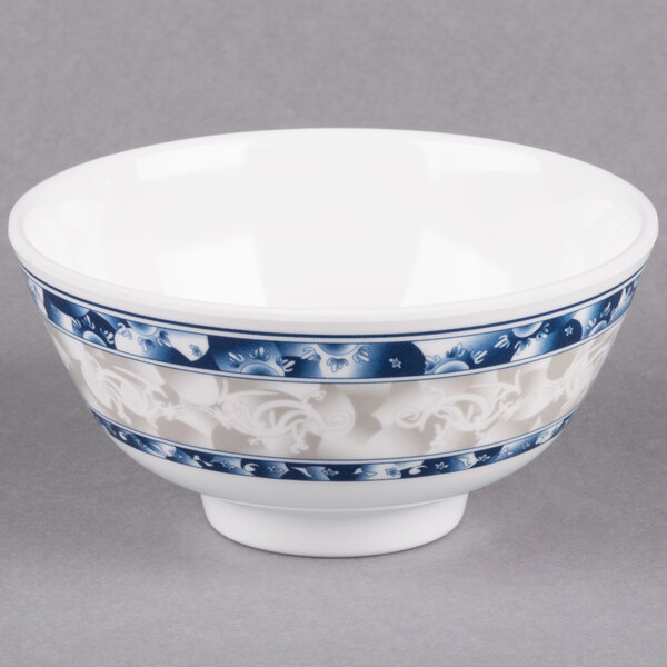 A white bowl with blue and white dragon designs.