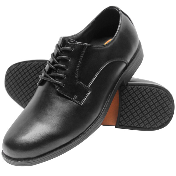 A pair of black lace-up oxford dress shoes with a smooth finish and textured non-slip soles.