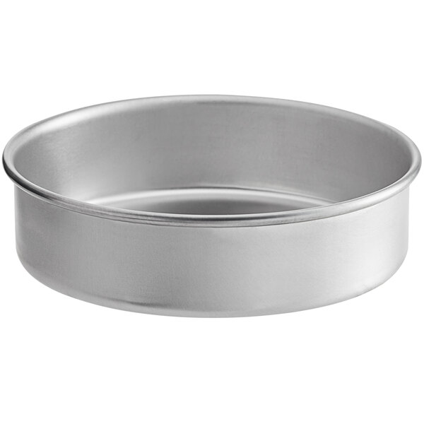 A round silver aluminum deep dish pizza pan.