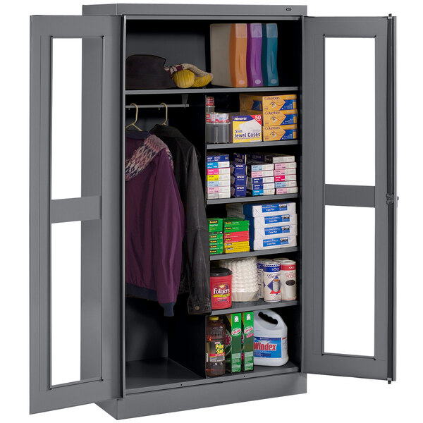 A dark gray metal Tennsco combination cabinet with open doors.