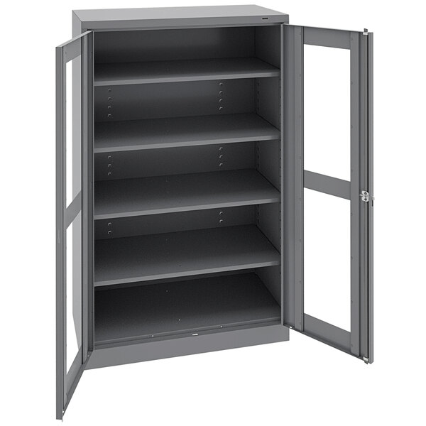 A dark gray metal Tennsco storage cabinet with open doors.