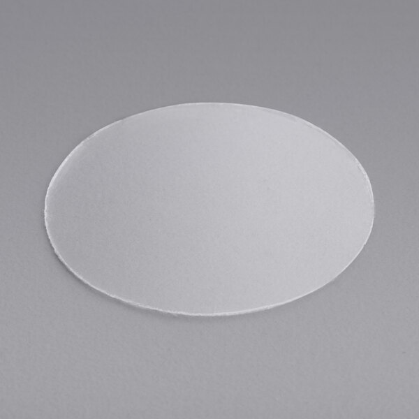 A white circular plastic hole cover.