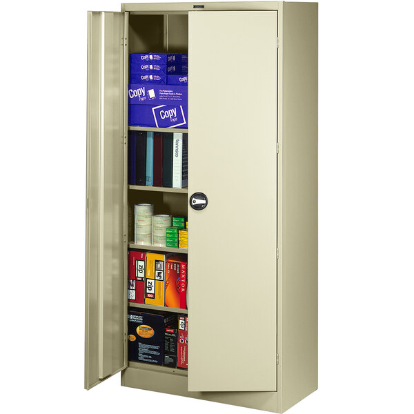 A white metal Tennsco storage cabinet with solid doors open.