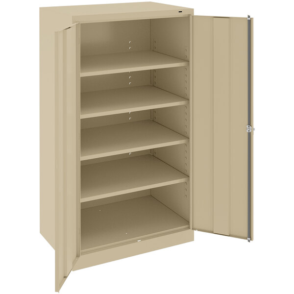 A tan Tennsco metal storage cabinet with open doors and shelves.