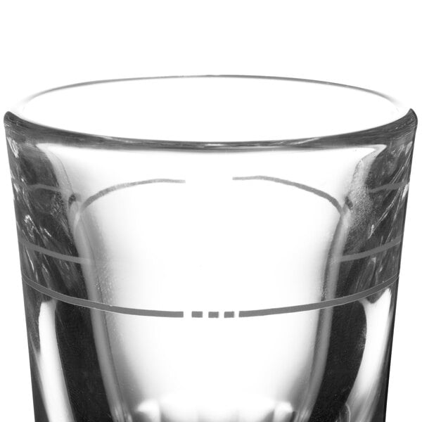 A Libbey fluted shot glass with a design on it.