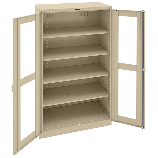 A tan Tennsco metal storage cabinet with open doors.