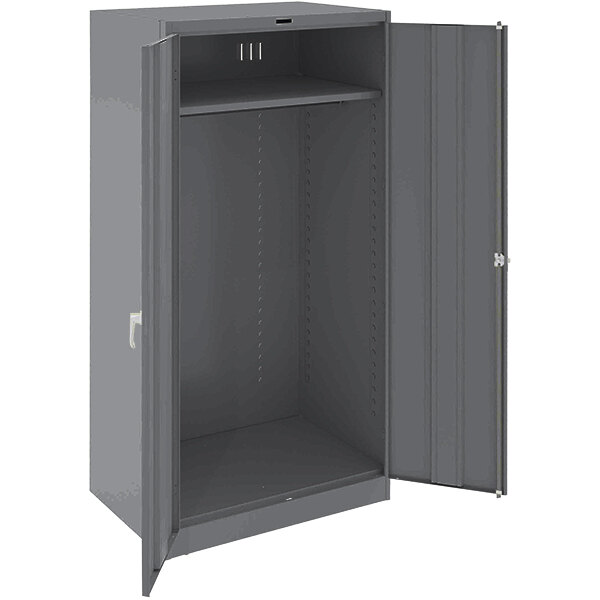 A dark gray metal Tennsco wardrobe cabinet with open doors.