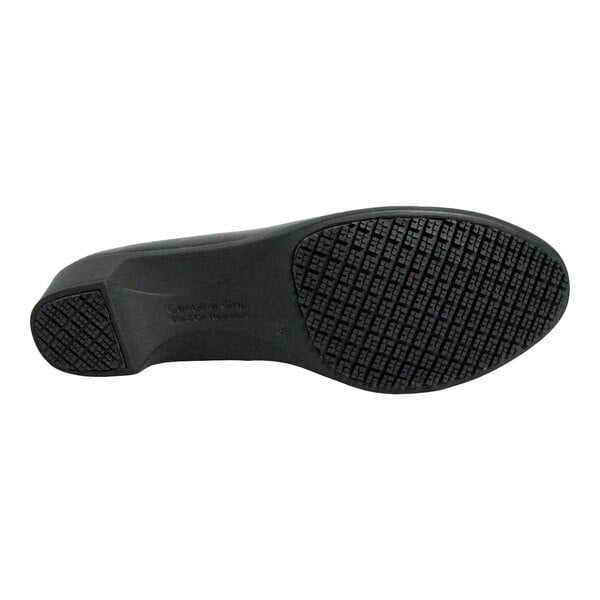 The image shows the black, textured sole of a dress shoe with a low heel.