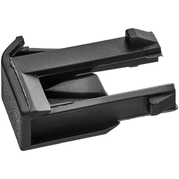 A black plastic Solwave door clip.