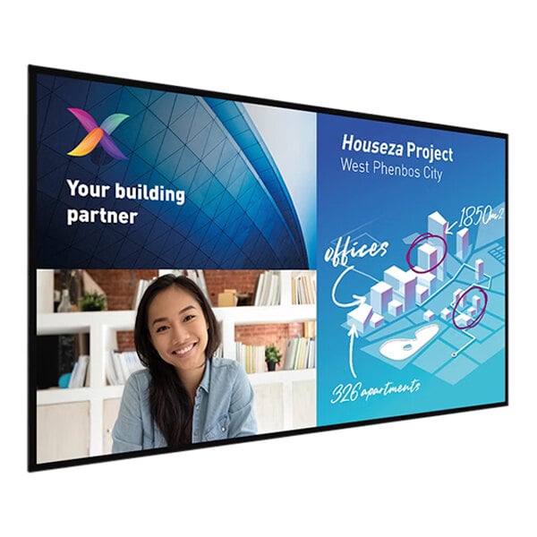 A woman smiling at a Philips 86" touchscreen television displaying a colorful logo with white text on a blue and white background.