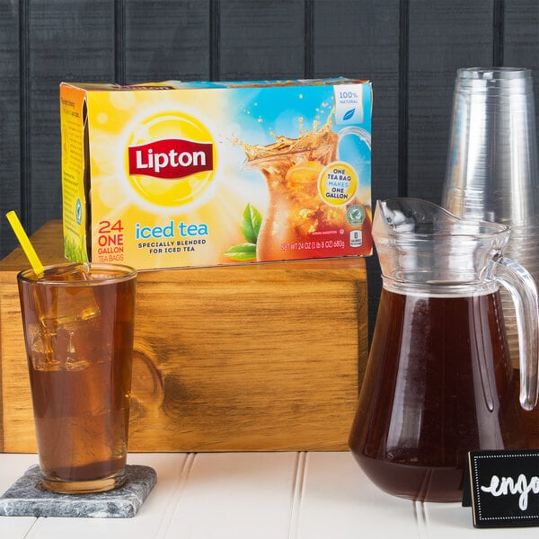A box of Lipton iced tea filter bags and a pitcher of iced tea.