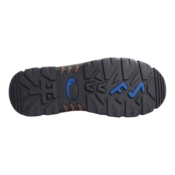 The image shows the black rubber outsole of a shoe with deep treads and blue accents.