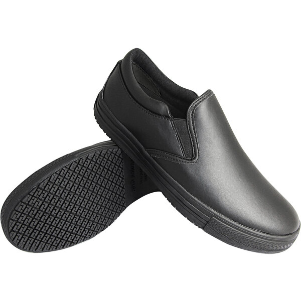 A pair of black slip-on shoes with a smooth upper and textured non-slip rubber soles.