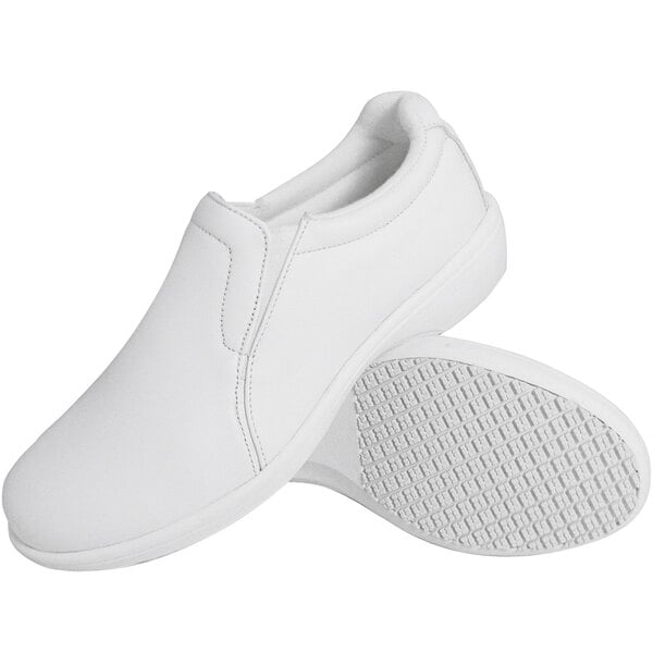 A pair of white Genuine Grip slip-on shoes.