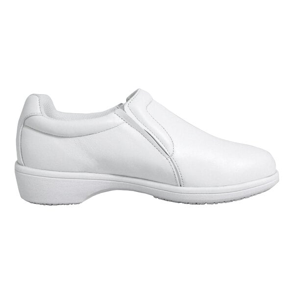 A white slip-on shoe with a low heel and smooth leather-like finish, shown in a side profile view.