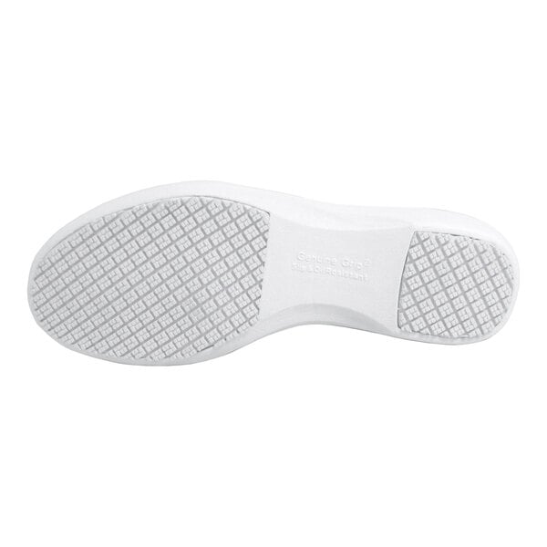 The image shows the white sole of a shoe with a textured, grid-like tread pattern.