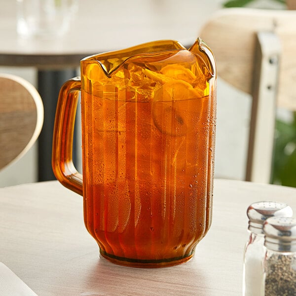 Choice 72 oz. Amber SAN Plastic Beverage Pitcher with 3 Spouts