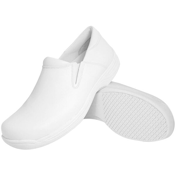 A pair of plain white slip-on shoes with textured non-slip soles, shown from a side and bottom view.