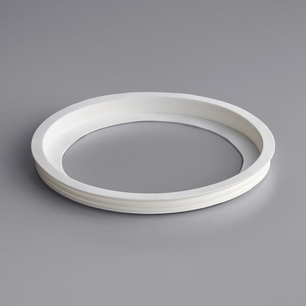 A white plastic Narvon bowl gasket with a white circle and a hole in it.