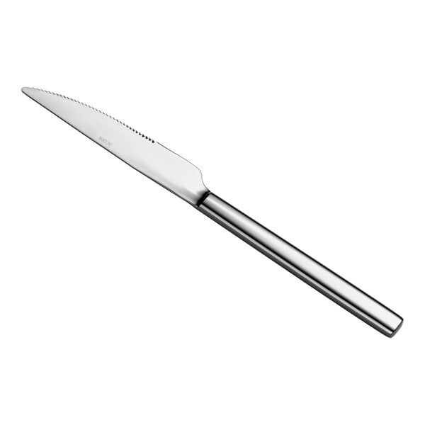 A stainless steel steak knife with a serrated blade and a smooth, cylindrical handle is shown against a white background.