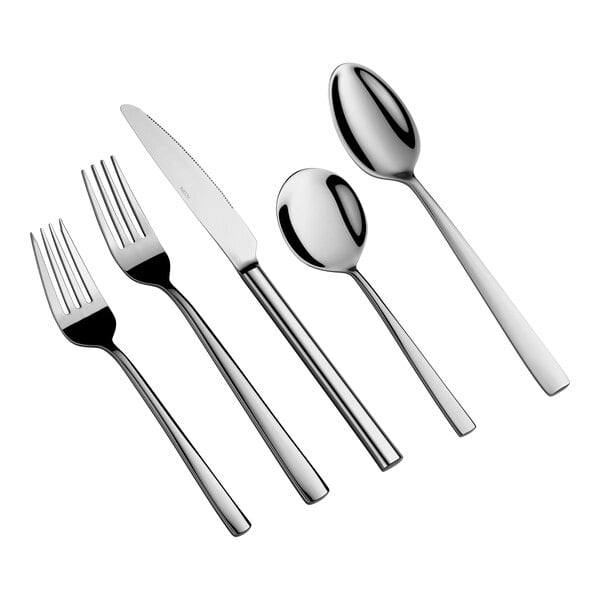 Five pieces of shiny, stainless steel flatware including two forks, a knife, and two spoons, arranged side by side on a white background.
