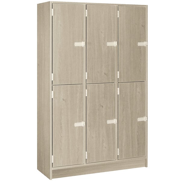 A natural elm triple door storage locker with middle shelf.