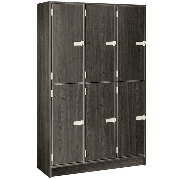 A dark elm I.D. Systems triple door locker with silver handles.