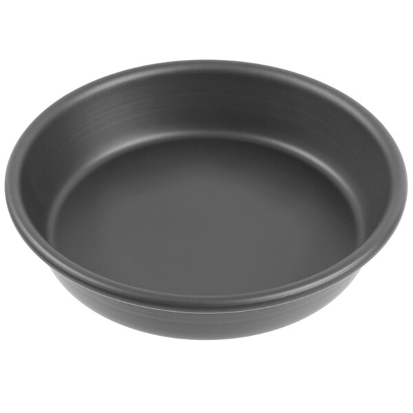 A black Chicago Metallic deep dish pizza pan.