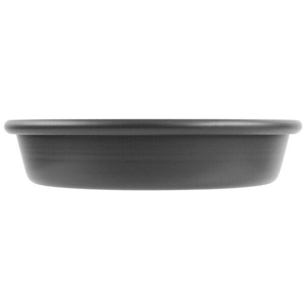A black round pan with a white background.