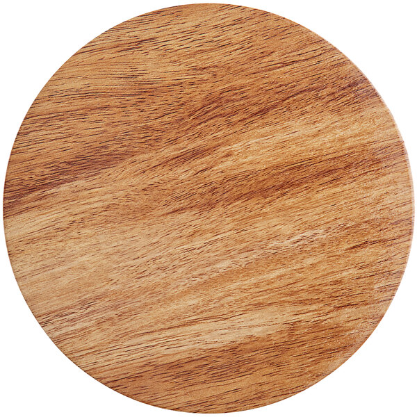 A circular wood and marble Enjay charcuterie board.