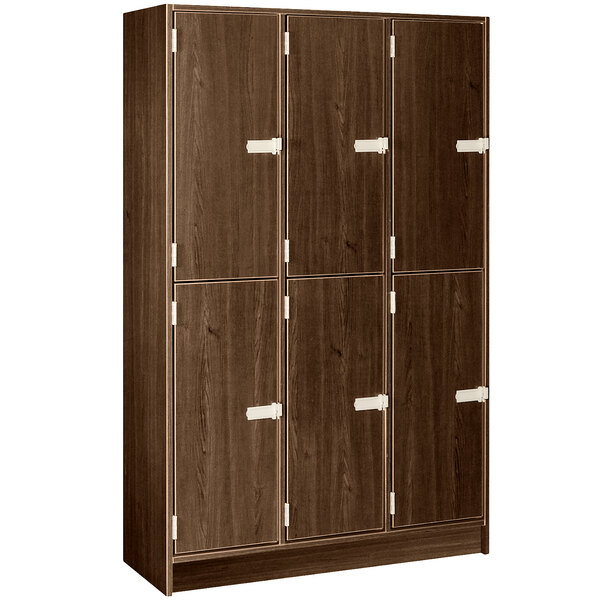 A dark brown wooden locker with four doors and white handles.