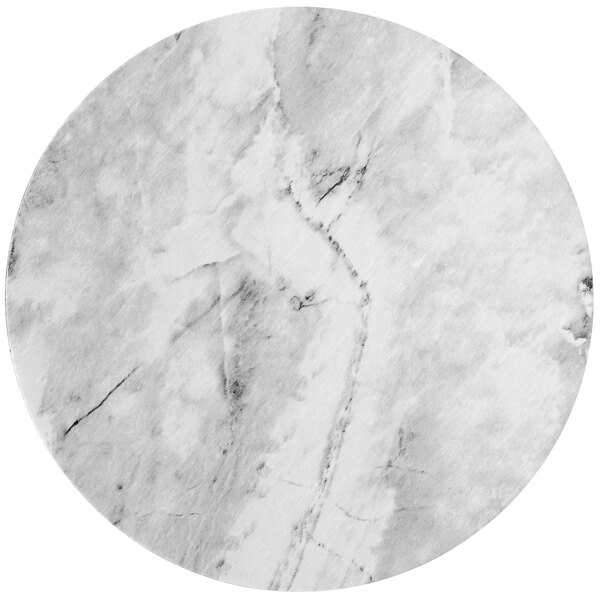 A white marble round and wood laminated cake board.