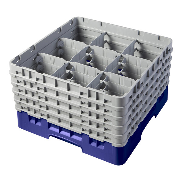 A navy blue plastic Cambro glass rack with 9 compartments and 5 extenders.